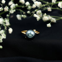 8 carat Tahitian pearl bypass engagement ring with diamond accents, featuring a sleek rose gold design by Rosec Jewels.