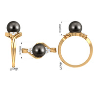 Bypass Tahitian Pearl engagement ring with diamond trio set in silver, featuring a unique intertwined design and dark pearl centerpiece.