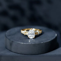 Pear Shaped Moissanite Solitaire Engagement Ring in Split Shank