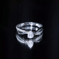 Pear Shaped Moissanite Infinity Engagement Ring
