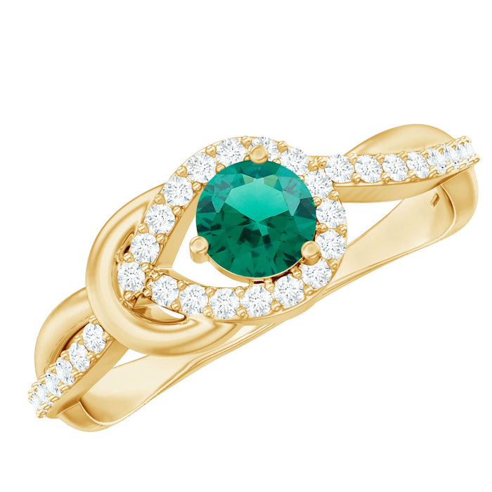 Lab-created emerald infinity promise ring with diamonds from Rosec Jewels, featuring a green emerald centerpiece and sparkling accents.