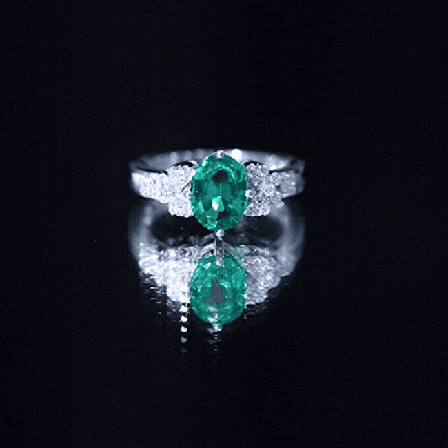 Yellow gold designer lab-grown emerald engagement ring with a central emerald gemstone and intricate band design by Rosec Jewels.