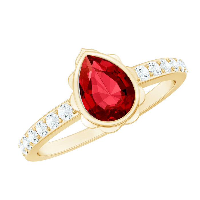 Bezel set lab-grown ruby teardrop engagement ring by Rosec Jewels, featuring a sparkling ruby gemstone and elegant silver band.