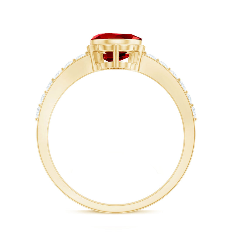 Bezel set lab-grown ruby teardrop engagement ring by Rosec Jewels featuring a sparkling ruby gemstone and elegant gold band.