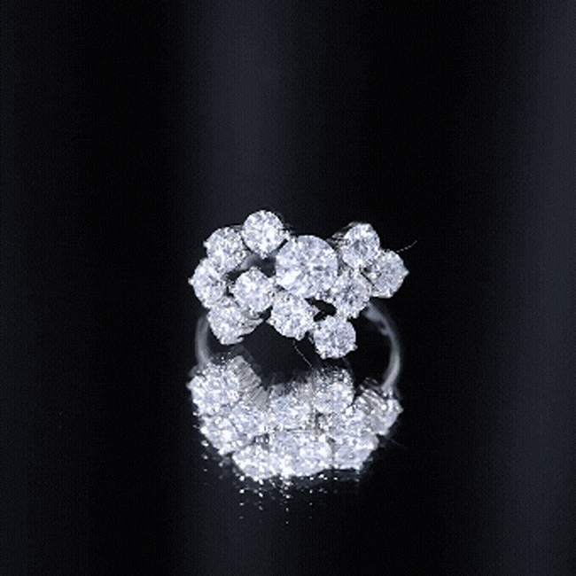 Silver cubic zirconia cluster engagement ring with sparkling white stones, designed by Rosec Jewels.