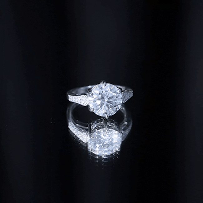 Certified 4.4 carat moissanite round engagement ring in silver, featuring a sparkling center stone and elegant band.