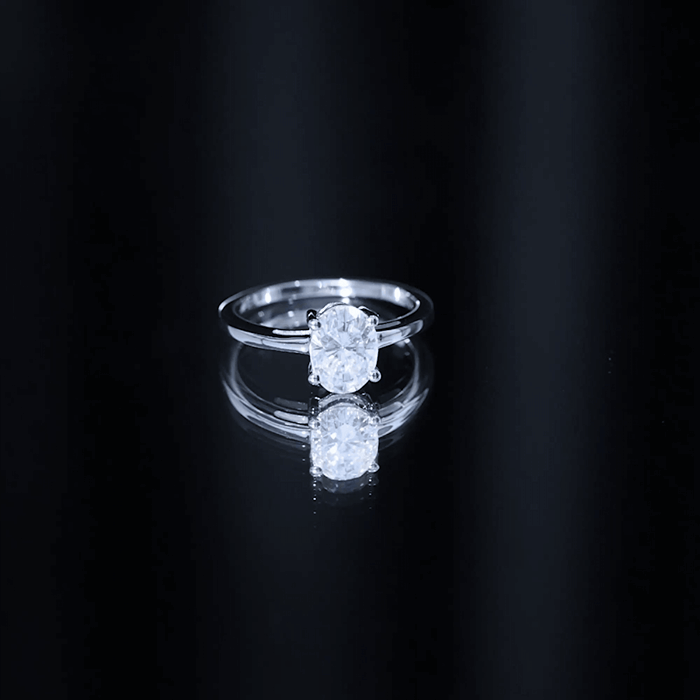 Certified 1.2 carat moissanite oval engagement ring in silver by Rosec Jewels, showcasing the sparkling gemstone and elegant band.