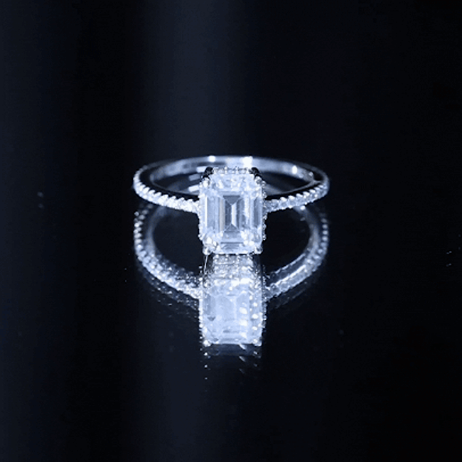Certified 1.87 carat Moissanite emerald cut engagement ring for women by Rosec Jewels, showcasing the sparkling gemstone and elegant band.