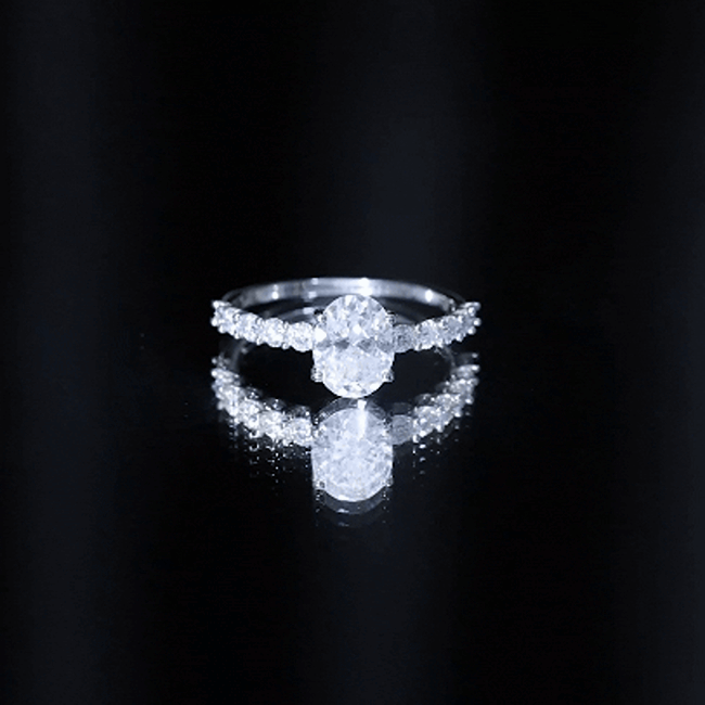 Certified 2 Carat Moissanite oval engagement ring with side stones from Rosec Jewels, showcasing the sparkling center stone and elegant design.
