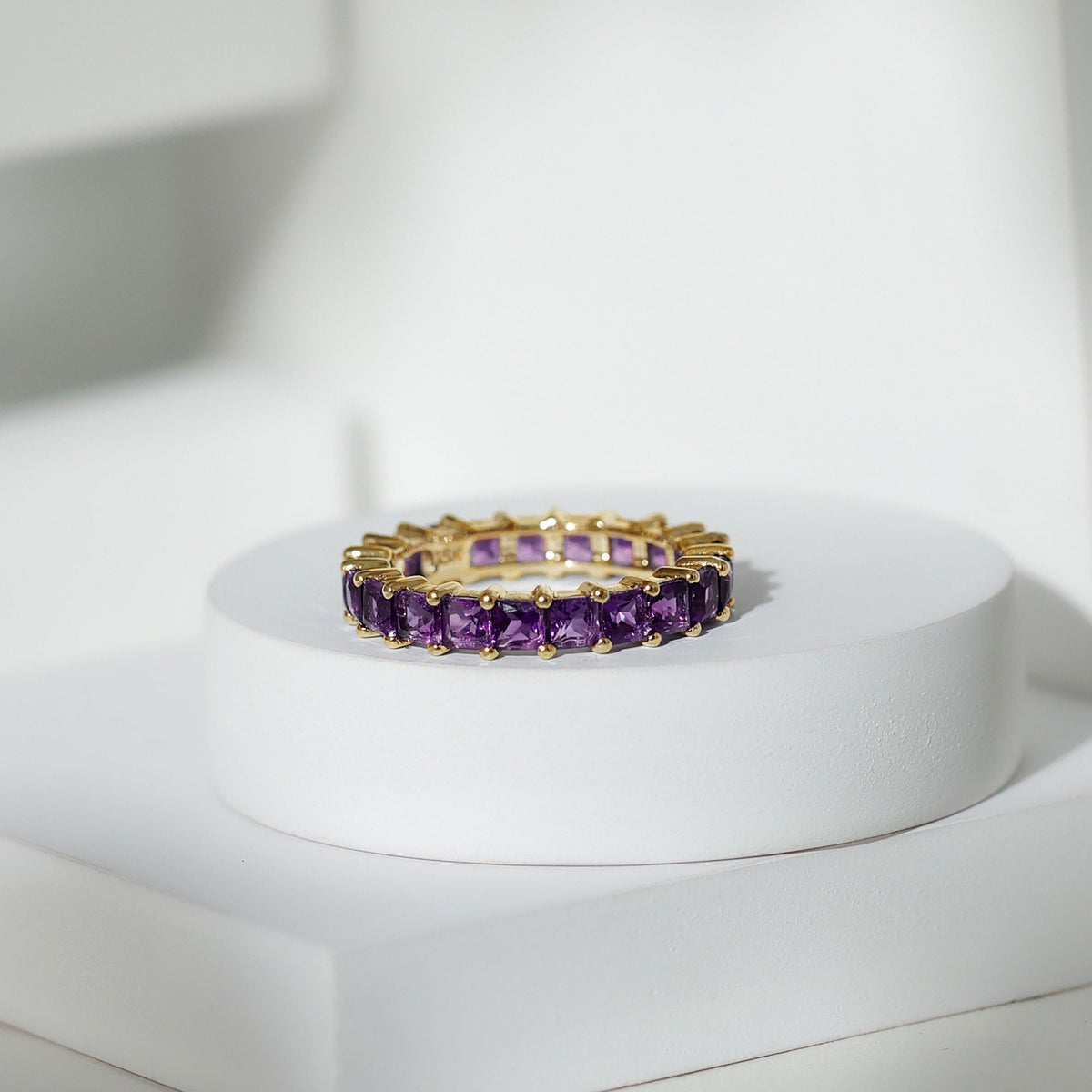 Rosec Jewels princess cut amethyst full eternity band ring with alternating gemstone settings on a silver band