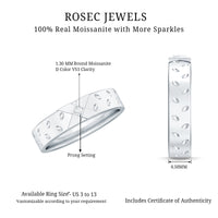 Two-tone rose gold and white gold cross wedding band with sparkling moissanite stones, showcasing intricate design and polished finish.