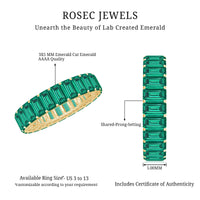 Emerald cut lab-grown emerald eternity wedding band by Rosec Jewels featuring a continuous row of sparkling green emeralds on a silver band.