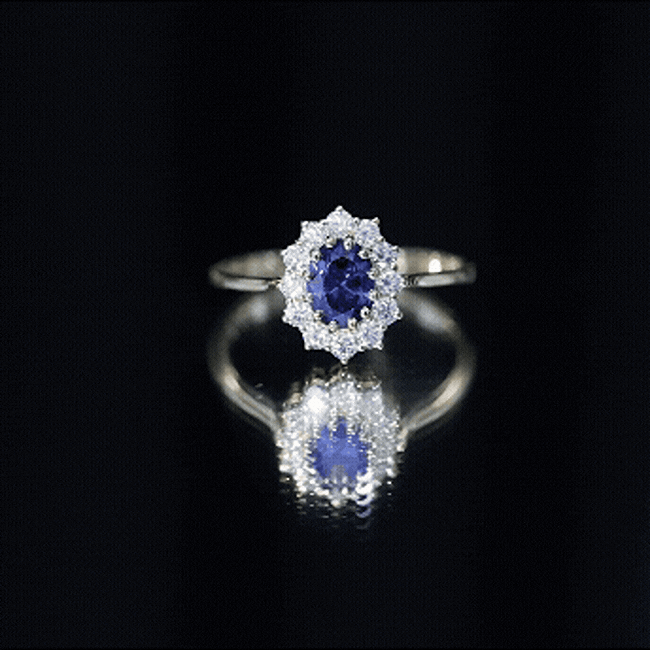 Oval lab-grown blue sapphire engagement ring with diamonds, 1.5 carats, by Rosec Jewels, featuring a yellow gold band and elegant design.