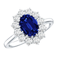 Oval lab-grown blue sapphire engagement ring with diamonds, showcasing a 1.5-carat center stone and intricate band design.