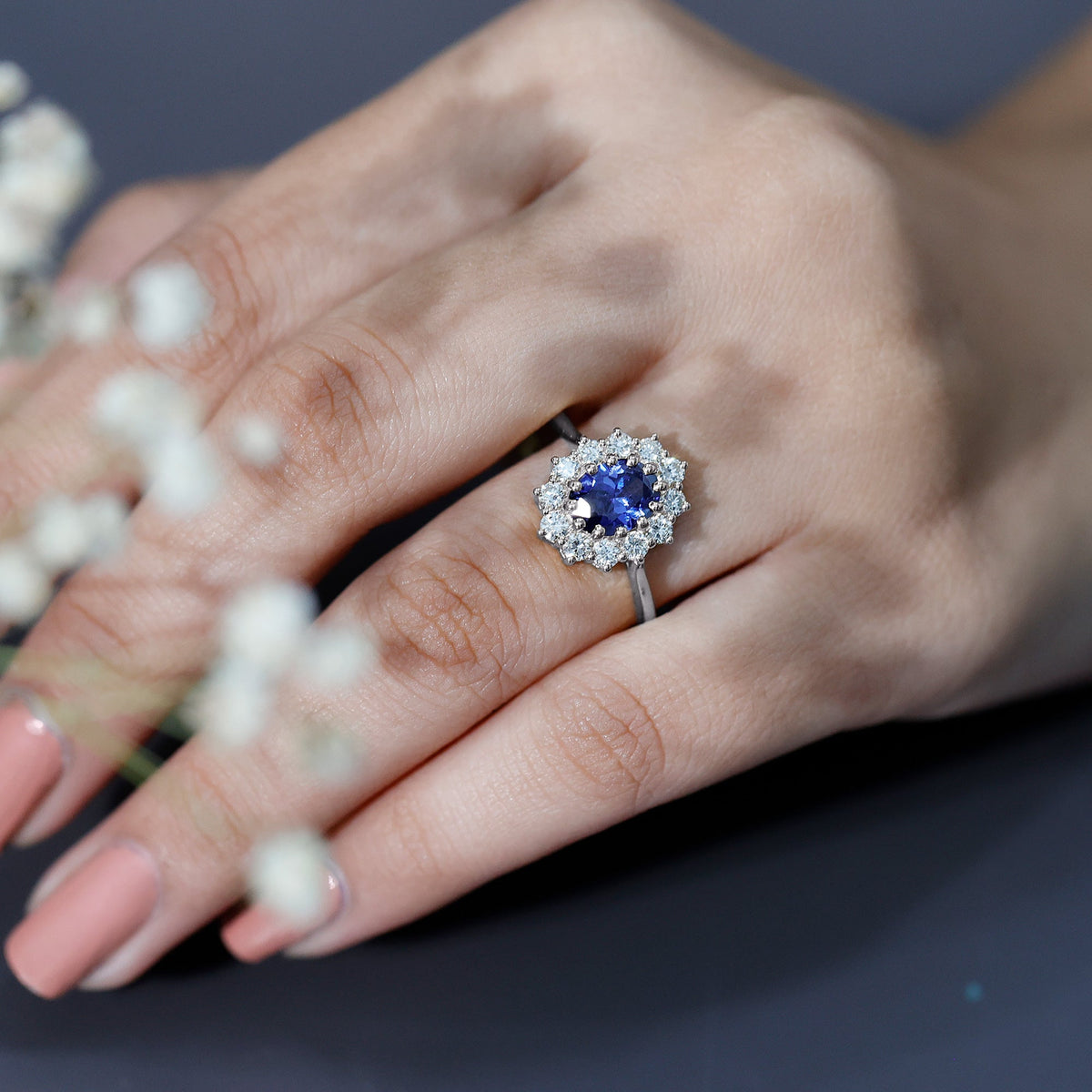 Certified 1.5 carat oval lab-grown blue sapphire princess Diana engagement ring with diamonds by Rosec Jewels.