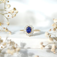 Rosec Jewels 1.5 carat oval lab-grown blue sapphire engagement ring with diamond accents, featuring a classic princess Diana style design.