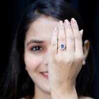 Oval lab-grown blue sapphire engagement ring with diamonds by Rosec Jewels, showcasing a 1.5 carat center gemstone and elegant design.