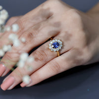 Oval lab-grown blue sapphire engagement ring with diamonds from Rosec Jewels, featuring a 1.5 carat gemstone in a elegant setting.