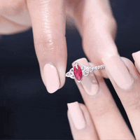 Lab grown ruby Celtic knot ring with diamond, yellow gold band, 0.75 carat, from Rosec Jewels, displayed on a ring size 13.