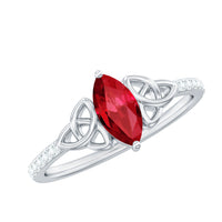 Lab-grown ruby Celtic knot ring with diamond accents, crafted by Rosec Jewels, showcasing intricate design and vibrant gemstone details.