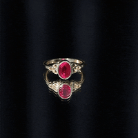Oval Shaped 1.5 Carat Lab Grown Ruby Celtic Engagement Ring in Bezel Setting