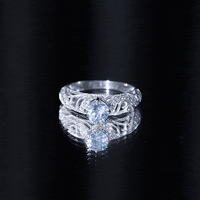 Vintage style aquamarine and diamond engagement ring from Rosec Jewels featuring a 0.8 carat center stone and intricate design.