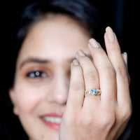 Vintage style aquamarine and diamond engagement ring by Rosec Jewels featuring a 0.8 carat center stone in a detailed ring setting.