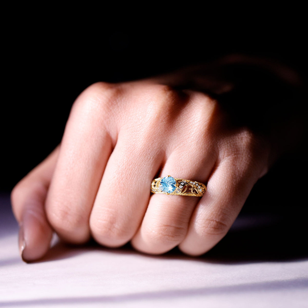 Vintage style aquamarine and diamond engagement ring from Rosec Jewels, featuring a 0.8 carat center stone and intricate band design.