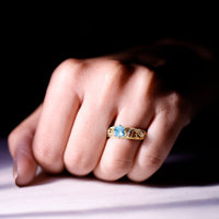 Vintage style aquamarine and diamond engagement ring from Rosec Jewels, featuring a 0.8 carat center stone and intricate band design.