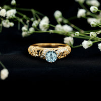 Vintage style aquamarine and diamond engagement ring with 0.8 carats, featuring intricate design from Rosec Jewels.