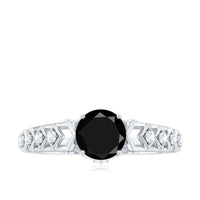 Black spinel solitaire engagement ring with a diamond accent, crafted by Rosec Jewels in an art deco-inspired design.
