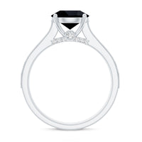 Natural black spinel solitaire engagement ring with diamond side stones, featuring a sleek band and elegant design from Rosec Jewels.