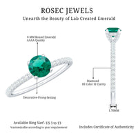 Lab grown emerald solitaire engagement ring with diamond accents, featuring a rose gold band and a prominent green gemstone.