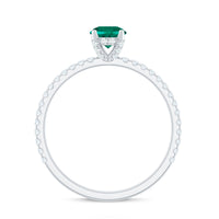 Rosec Jewels lab-grown emerald solitaire engagement ring with a diamond setting, showcasing a vibrant green emerald and sparkling gemstone.