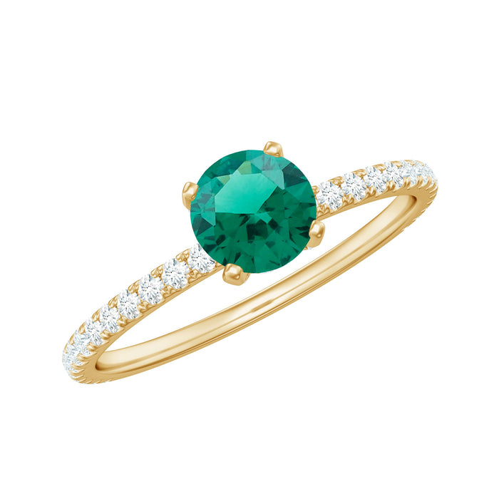 Lab grown emerald solitaire engagement ring with a diamond, featuring a sleek gold band and intricate detailing by Rosec Jewels.