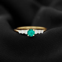 Rosec Jewels round lab-grown emerald and diamond promise ring with certificate, featuring a polished gold band and intricate design.