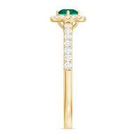 Lab grown emerald diamond halo engagement ring by Rosec Jewels, featuring a central emerald surrounded by sparkling diamonds.