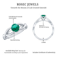 Lab-grown emerald crossover ring by Rosec Jewels featuring diamonds and intricate design, showcasing the ring's elegance and sparkle.