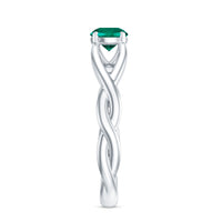 Lab-grown emerald crossover ring with diamond accents from Rosec Jewels, showcasing a green emerald and sparkling diamonds.
