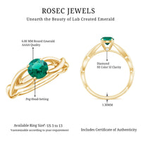 Lab grown emerald crossover ring with diamond accents by Rosec Jewels, showcasing a green emerald centerpiece and sparkling diamonds.