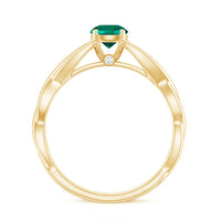 Lab-grown emerald crossover ring with diamond accents, crafted by Rosec Jewels, featuring a sleek gold band and intricate design.