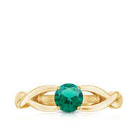Lab-grown emerald crossover ring with diamond accents from Rosec Jewels, showcasing a elegant design and vibrant green gemstone.