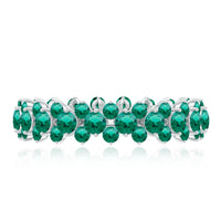 Certified lab-grown emerald eternity ring by Rosec Jewels featuring a continuous row of vibrant green emeralds on a sleek band.