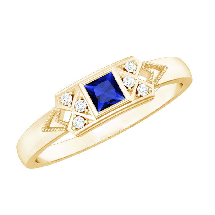 Rosec Jewels Art Deco princess cut lab-grown blue sapphire ring with diamond accent, featuring elegant design and sparkling gemstones.