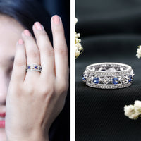 Lab-created blue sapphire and diamond eternity band ring by Rosec Jewels, featuring a full circle of sparkling gemstones.