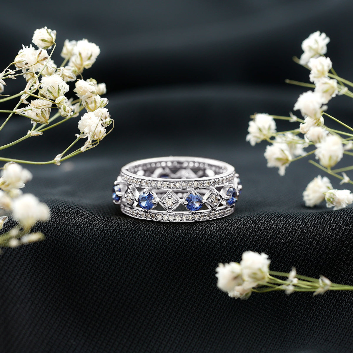 Lab created blue sapphire and diamond full eternity band ring from Rosec Jewels, showcasing sparkling gemstones around the band.