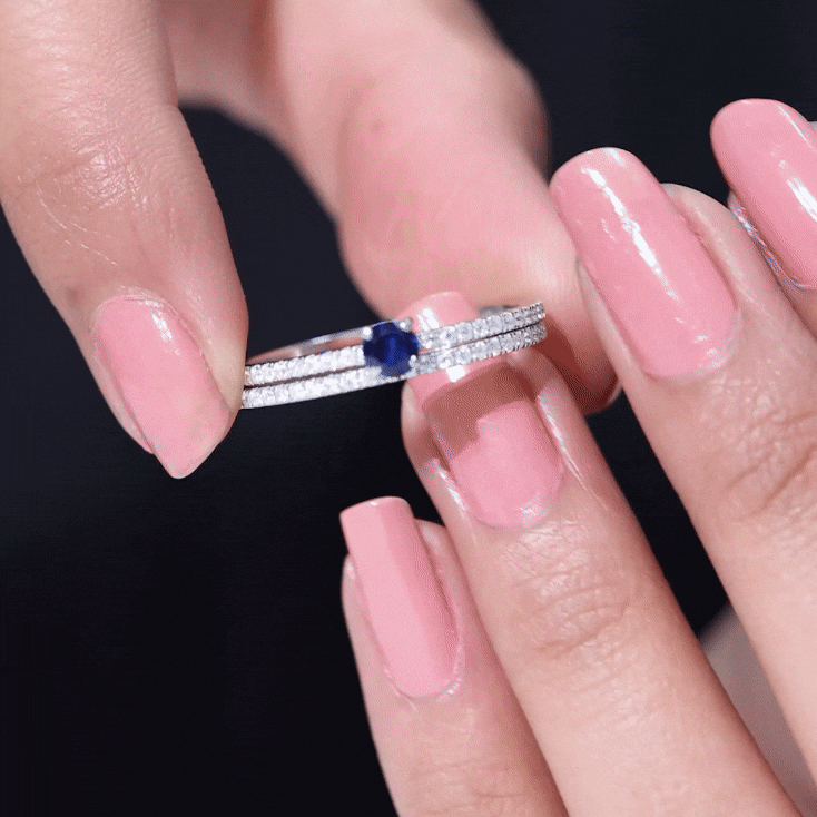 Lab grown blue sapphire engagement ring set with diamonds, featuring a 0.6 carat center stone in a Rosec Jewels ring design.