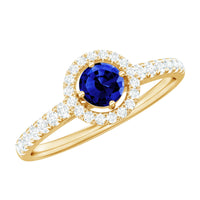 Certified 0.6 carat lab-grown blue sapphire diamond engagement ring with halo setting, featuring rose gold band and intricate details.