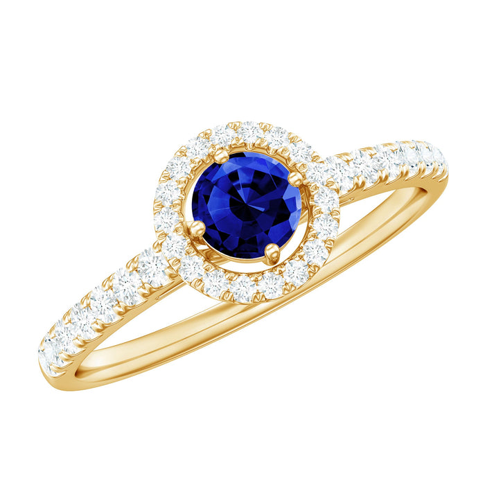 Certified 0.6 carat lab-grown blue sapphire diamond engagement ring with halo setting, featuring rose gold band and intricate details.