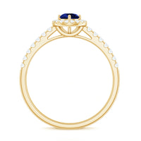Lab-grown blue sapphire diamond engagement ring with halo setting, 0.6 carats, from Rosec Jewels, showcasing intricate design and sparkling stones.
